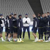 Solid start: Tottenham manager Mauricio Pochettino (center), directing his players during a training session, has brought positive changes to the Premier League team in the first few months of the season. Pochettino making believers out of Tottenham fans