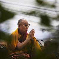Tibetan spiritual leader the Dalai Lama prays during Ganden Ngachoe, the death anniversary of 14th Century Tibetan Saint-Scholar Lama Tsongkhapa, in New Delhi on Dec. 16. China offers up to $50,000 in cash for terrorism tips in Tibet