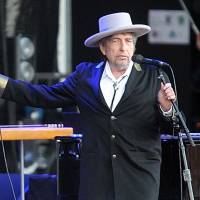 U.S. singer-songwriter Bob Dylan performs on stage at “Les Vieilles Charrues” Festival in Carhaix, western France, in 2012. The icon is on the cover of AARP magazine’s February/March 2015 issue. He says in the interview that “if I had to do it all over again, I’d be a schoolteacher.” Bob Dylan, 'wise' at 73, gives album free to seniors