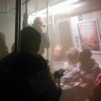 Smoke fills a Washington Metro system subway car near the L’Enfant Plaza station in Washington on Monday. The transit network remained hobbled Tuesday morning after an electrical malfunction filled the busy subway station with smoke, killing one woman and sending dozens of people to hospitals. Washington subway system hobbled after fatal accident