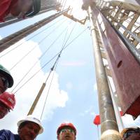 Late Venezuelan President Hugo Chavez visits offshore oil workers in the Orinoco oil belt in August 2006. U.S. attempts to break Caribbean addiction to Venezuelan oil