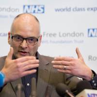 Infectious Diseases Consultant Dr. Michael Jacobs holds a press conference at the Royal Free Hospital in London on Wednesday, a day after the first Ebola patient to be diagnosed in the U.K. arrived at a hospital from Glasgow. The patient, a volunteer nurse who contracted Ebola while working in Sierra Leone, was airlifted from Scotland to the Royal Free Hospital in London on Tuesday. Top U.K. doctor: Ebola screening should be improved
