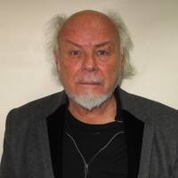 Former pop star Gary Glitter, whose real name is Paul Gadd, is shown in his British custody photograph on Feb. 6 in London after being convicted on six charges of sexual assault. Glam rock star Gary Glitter gets 16 years for child abuse