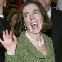 Oregon Secretary of State Kate Brown waves at former legislative colleagues as she is escorted into the joint session of the Legislature in Portland on Jan. 12, 2009. Bisexuals hopeful as one of their own becomes a U.S. governor