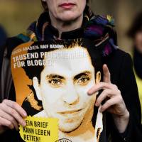 An Amnesty International activist hods a picture of Saudi blogger Raif Badawi during a Jan. 29 protest over his flogging punishment in front of the Saudi Arabian Embassy in Berlin. Several of this year’s Nobel Peace Prize nominations, including Flemming Rose, Saudi blogger Badawi, who is serving a 10-year jail sentence for insulting Islam, and fugitive U.S. intelligence analyst Edward Snowden, pay tribute to freedom of expression and the victims of the Charlie Hebdo massacre, according to early indications of the names put forward for the prestigous award. Free speech all the buzz in Nobel nominations