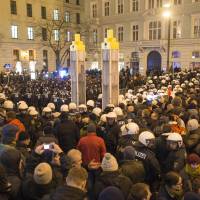 Austrian riot police separate sympathizers (front) of right-wing populist movement PEGIDA (Patriotic Europeans Against the Islamization of the Occident) from counterdemonstrators in the center of Vienna on Monday. Anti-Islam group PEGIDA holds first Austria march