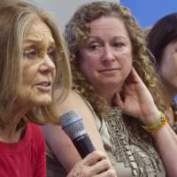 Organizers of the effort called WomenCrossDMZ.org (from left) honorary co-chair Gloria Steinem, filmmaker and philanthropist Abigail Disney and professor of Korean history at Rutgers University Suzy Kim hold a United Nations news conference announcing plans Wednesday for a rare and risky women's walk across the demilitarized zone between North and South Korea to call for reunification. Steinem, other women announce plan to walk Korean DMZ