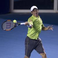 Unforced errors hurt: Kei Nishikori plays a shot from David Ferrer in the final of the Mexico Open on Saturday night. Ferrer tops Nishikori in final