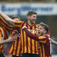 Still in the hunt: Bradford City's Jon Stead (second from right) and his teammates are vying to reach the FA. Cup semifinals. Premier League powers generate most interest in F.A. Cup