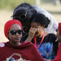 A woman is consoled while a Nigerian protest group continues their sit-in about the girls still missing from Chibok, in Abuja, Nigeriam, Wednesday. Nigeria’s military said on Wednesday it had transported nearly 300 women and girls rescued from Boko Haram to the hilly border town of Gwoza. The 200 girls and 93 women were freed from four camps during an army operation in northeastern Borno province as the Nigeria military bears down on what are believed to be Boko Haram’s final strongholds in the Sambisa forest. Intense psychological care said needed for girls, women rescued from Boko Haram