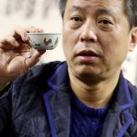 Chinese businessman and antique collector Liu Yiqian, founder of the Long Museum, shows off the porcelain “Chicken Cup” from the Ming Dynasty (1368-1644), which he bought for $36 million at a Hong Kong auction in December. The expensive antics of China's gaudiest billionaire