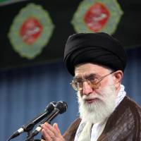 Iran's Supreme Leader Ayatollah Ali Khamenei waves as he arrives for a meeting with the heads of the Iranian judiciary system in Tehran on June 28, 2006. Khamenei was quoted saying he saw no use in negotiating with the United States and again signaled that Tehran was unwilling to halt its nuclear program. Iran nuclear weapons a U.S. 'myth': Khamenei