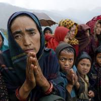 Ramaya pleads for food Wednesday after an aid relief helicopter lands at the remote mountain village of Gumda, near the epicenter of Saturday’s massive earthquake in the Gorkha District of Nepal. Aid reached the hilly district for the first time Wednesday, four days after the quake struck. Food, other aid starting to reach Nepal's remote quake-hit villages