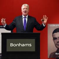 Bonhams co-chief executive officer Patrick Meade administrates an auction of a handwritten manuscript belonging to British mathematician and World War II code breaker Alan Turing in New York on Monday. The long-lost notebook sold for $1.025 million in two minutes of bidding. Wartime notes of Turing of 'Imitation Game' fame fetch over $1 million