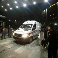 An ambulance leaves the Justice Palace in Istanbul on Tuesday. A Turkish prosecutor was critically injured and two of his captors were killed on Tuesday, after security forces stormed the courthouse where a far-left group had taken the prosecutor hostage, Istanbul's police chief said. The prosecutor later died. Leftist attackers, hostage prosecutor die in Istanbul shootout