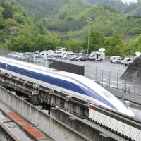 This file photograph from May 2010 shows the maglev (magnetic levitation) train on an experimental track in Tsuru, Yamanashi Prefecture. Maglev train clocks 603 kph, setting new world record