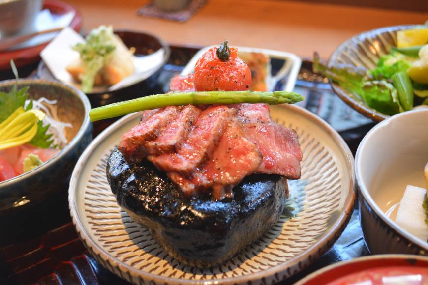 Grand Kitchen Tada Don't touch: Wagyu beef, sizzling on top of a heated rock, is the main feature of Grand Kitchen Tada's considered maru gozen course meal. | J.J. O'DONOGHUE