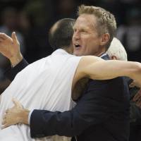 Remarkable season: First-year Warriors coach Steve Kerr, hugging Spurs guard Manu Ginobili after the teams' game on April 5, has guided Golden State to one of the best seasons in NBA history. Kerr employing Jackson's philosophy with Warriors