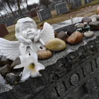 True legend: The grave of jazz singer and songwriter Billie Holiday at Saint Raymond's Cemetery in New York. Broken in life, Billie Holiday adored at 100