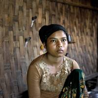 Rorbiza rests at home May 12 in Dapaing, north of Sittwe, western Rakhine state, Myanmar, after escaping from a human trafficking boat. Brokers promise pretty young girls the prospect of arranged marriages in Malaysia, though activists say in recent years many have instead been sold into prostitution. Rohingya children tricked into boarding trafficking boats, then held captive