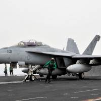In this April 15, 2015 U.S. Navy handout photo, an F/A-18 Super Hornet prepares to launch from the flight deck of the aircraft carrier USS Theodore Roosevelt (CVN 71). An F-18 crashed in the Arabiann Gulf after taking off from the carrier Tuesday but both crew members survived without major injuries, military officers said. The Super Hornet aircraft had launched from the USS Theodore Roosevelt in the Arabian Gulf at 1330 GMT before it went down, the US Navy said in a statement. Crew rescued after carrier fighter crashes in Arabian Gulf