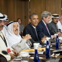 President Barack Obama sits with Kuwaiti Emir Sheikh Sabah Al-Ahmad Al-Sabah (left center) Secretary of State John Kerry (right center) and other Gulf Cooperation Council leaders and delegations at Camp David, Maryland, Thursda. Obama and leaders from six Gulf nations are trying to work through tensions sparked by the U.S. bid for a nuclear deal with Iran, a pursuit that has put regional partners on edge. Obama is seeking to reassure the Gulf leaders that the U.S. overtures to Iran will not come at the expense of commitments to their security. Gulf nations get 'ironclad' security commitment from Obama
