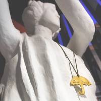 A necklace of a yellow umbrella, symbol of the Hong Kong pro-democracy movement, reading Love Peace hangs on statue of the Goddess of Democracy at the June 4th Museum in the city on June 3, a day ahead of the 26th anniversary of the bloody crackdown on protesters in Beijing's Tiananmen Square. China extends reach into Hong Kong to thwart democrats