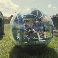 This photo provided by Universal Pictures shows Nick Robinson (left) as Zach and Ty Simpkins as Gray in a scene from the film, Jurassic World, directed by Colin Trevorrow, in the next installment of Steven Spielberg's groundbreaking Jurassic Park series. The Universal Pictures 3-D, which debuted Friday, set a weekend box office record of $511 million worldwide. 'Jurassic World' chews up rivals to set box office record world debut at $511 million