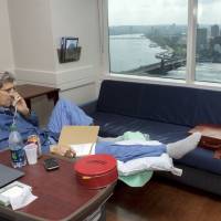 In this photo provided by the State Department, Secretary of State John Kerry speaks on Tuesday to National Security Adviser Susan Rice from his hospital room at Massachusetts General Hospital in Boston. Kerry is recovering from surgery to repair a broken right femur he suffered during a biking accident in France. Kerry tweets photo from hospital 10 days after breaking femur