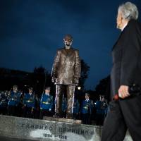 A Serbian army honor guard stands behind the 2-meter (6.6-foot) bronze statue of Gavrilo Princip after an unveiling ceremony at a park in downtown Belgrade on Sunday. Serbia unveils monument to WWI-triggering assassin Gavrilo Princip