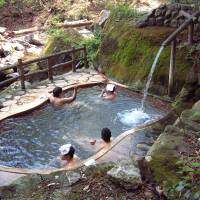 In this undated photo, visitors bathe in Fudonoyu, an open-air onsen in the mountainous Shiobara resort area in Nasushiobara, Tochigi Prefecture. Tochigi mixed-bath hot-spring is forced to close after group sex rumors