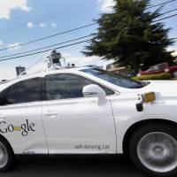 In this May file photo, Google’s self-driving Lexus drives along a street during a demonstration at Google campus in Mountain View, California. Google says that one of its self-driving cars has been involved in an injury accident for the first time. The tech giant disclosed Thursday that one of its SUVs was rear-ended in its home city of Mountain View, and the three people on board complained of minor whiplash. All were released from the hospital soon after the July 1 collision. Rear-ended while stopped, one of Google's self-driving cars involved in first injury accident