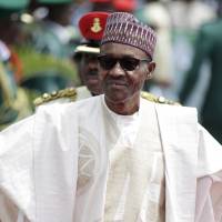 Former Gen. and Nigerian President Muhammadu Buhari arrives May 29 for his Inauguration at the eagle square in Abuja, Nigeria. One month after taking office, Nigeria’s new president has not yet named a Cabinet to help him cope with this country’s firestorm of troubles. Nigeria's new president faces firestorm of woes but yet to pick Cabinet