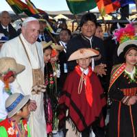Pope Francis walks next to Bolivian President Evo Morales upon arrival in El Alto, on Wednesday. Francis, the first Latin American pontiff, arrived in Bolivia on the second leg of a three-nation tour of the continent’s poorest countries, where he has been acclaimed by huge crowds. Pope pays brief high-altitude Bolivia visit, praises reforms, pays tribute to slain priest