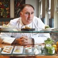 This March 15, 2011, file photo shows chef Jose Andres at his Minibar restaurant in Washington. Andres is backing out of a plan to open a flagship restaurant in Donald Trump’s new hotel under construction in Washington. Andres issued a statement Wednesday, citing Trump’s statements “disparaging immigrants” in his decision to cancel plans for a new eatery at the Trump International Hotel. Star chef Andres drops plan for flagship in Trump hotel going up in Washington