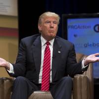 Donald Trump, president and chief executive of Trump Organization Inc. and U.S. 2016 presidential candidate, speaks during The Family Leadership Summit in Ames, Iowa, on July 18. The sponsor, The Family Leader, is a pro-family, pro-marriage, pro-life organization which champions the principle that God is the ultimate leader of the family. Trump is facing lawsuits over his Trump University wealth seminars by plaintiffs who were allegedly promised financial success at a cost. Suits against 'Trump University' success seminars paint harsh reality of financial deceit