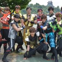 Performers of Ninja Boimenkun pose in front of Inuyama Castle in Aichi Prefecture. Tokai broadcaster pushes ninja idol adventure overseas
