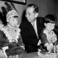 Prime Minister Nobusuke Kishi is pictured with grandsons Shinzo Abe (right) and his brother in Tokyo in July 1957. The boys are wearing costumes Kishi brought home as souvenirs from Washington. Analyzing Abe's fixation on the Constitution