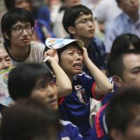 Soccer fans watch a live broadcast of the Woman’s World Cup soccer final match between Japan and the United States at a public viewing venue in Tokyo on Monday. Nadeshiko fans unbowed by 5-2 loss to U.S. in World Cup final