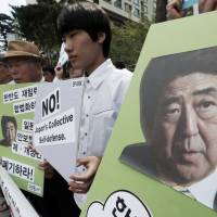 Not impressed: South Korean protesters stage a rally Thursday against the possible approval of controversial security legislation by the Diet. Abe's historic opportunity to reset regional relations