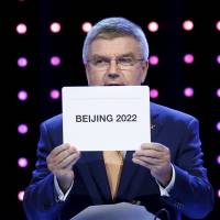 Thomas Bach, president of the IOC, on Friday announces Beijing as the host for the 2022 Winter Olympics during the 128th International Olympic Committee Session, in Kuala Lumpur. Beijing awarded 2022 Winter Olympics