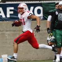 Japan wide receiver Takashi Kurihara scores on a 70-yard reception in the first quarter against Mexico on Wednesday at Tom Benson Hall of Fame Stadium in Canton, Ohio, in the IFAF world championship. Japan won 35-7. Japan, U.S. to battle for football supremacy
