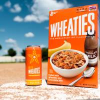 This undated photo provided by General Mills shows a box of Wheaties cereal next to a can of limited-edition HefeWheaties beer. Wheaties said it is partnering with a craft brewery to make the beer. For the cereal drinker: Wheaties, brew of champions