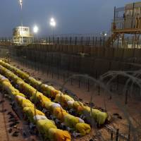 Detainees pray at Camp Bucca, a U.S. military detention facility on the outskirts of Baghdad, in March 2009. Abu Bakr al-Baghdadi, now leader of the Islamic State group, was held there. Islamic State group's top command dominated by ex-officers in Saddam's army