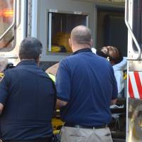 A man is loaded into a Good Fellowship ambulance after a shooting in the lobby of the Chester County Courthouse in West Chester, Pennsyvania, just before noon Tuesday. The Daily Local News of West Chester reports that the shooting involved a member of the Chester County sheriff’s office and a man who apparently tried to enter the courthouse. Man who scaled White House wall in March slashes cop at court, is killed
