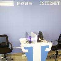 Computers with no keyboard stand in an Internet corner at the airport in Pyongyang on Monday. New North Korean airport's Internet room connects to nothing