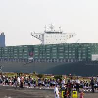 A containership crosses the new section of the Suez Canal after the opening ceremony in Ismailia, Egypt, Thursday. Egypt staged a show of international support on Thursday as it inaugurated a major extension of the Suez Canal, which President Abdel Fattah al-Sisi hopes will power an economic turnaround in the Arab world's most populous country. Nationalism tempered by terrorism fears as Egypt unveils Suez Canal extension