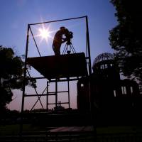 A cameraman films the Atomic Bomb Dome in Hiroshima on Tuesday. Japan will mark on Thursday the 70th anniversary of the attack on Hiroshima, where the U.S. dropped an atomic bomb on Aug. 6, 1945, killing about 140,000 by the end of the year in a city of 350,000 residents. The grandson of Paul Tibbets, the pilot of the U.S. Enola Gay bomber, said Tibbets was dedicated to following the orders of the president. Enola Gay pilot Tibbets committed to president's orders, grandson says
