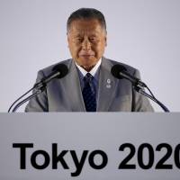 Big talk: Former Prime Minister Yoshiro Mori addresses the media at a news conference on July 24 where Tokyo's Olympic emblems were unveiled. Going for gold in the stadium blame game