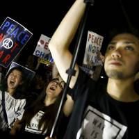Speaking up: Students shout slogans during a rally denouncing Prime Minister Shinzo Abe's administration outside the Diet in Tokyo on July 24. A political turning point for Japan's youth